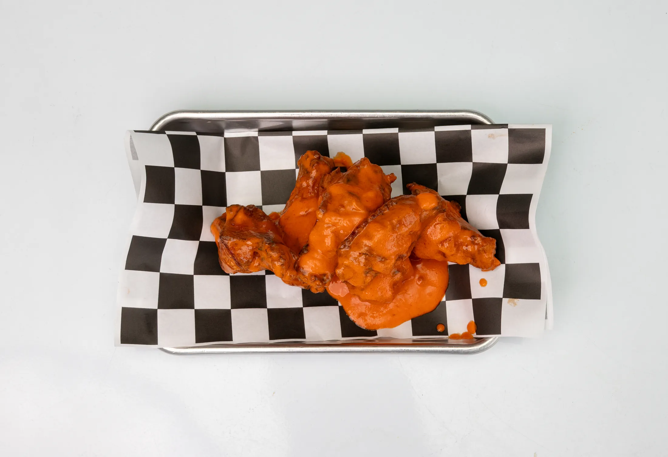 Six-piece buffalo wings with celery and blue cheese dip at The Rusty Roost