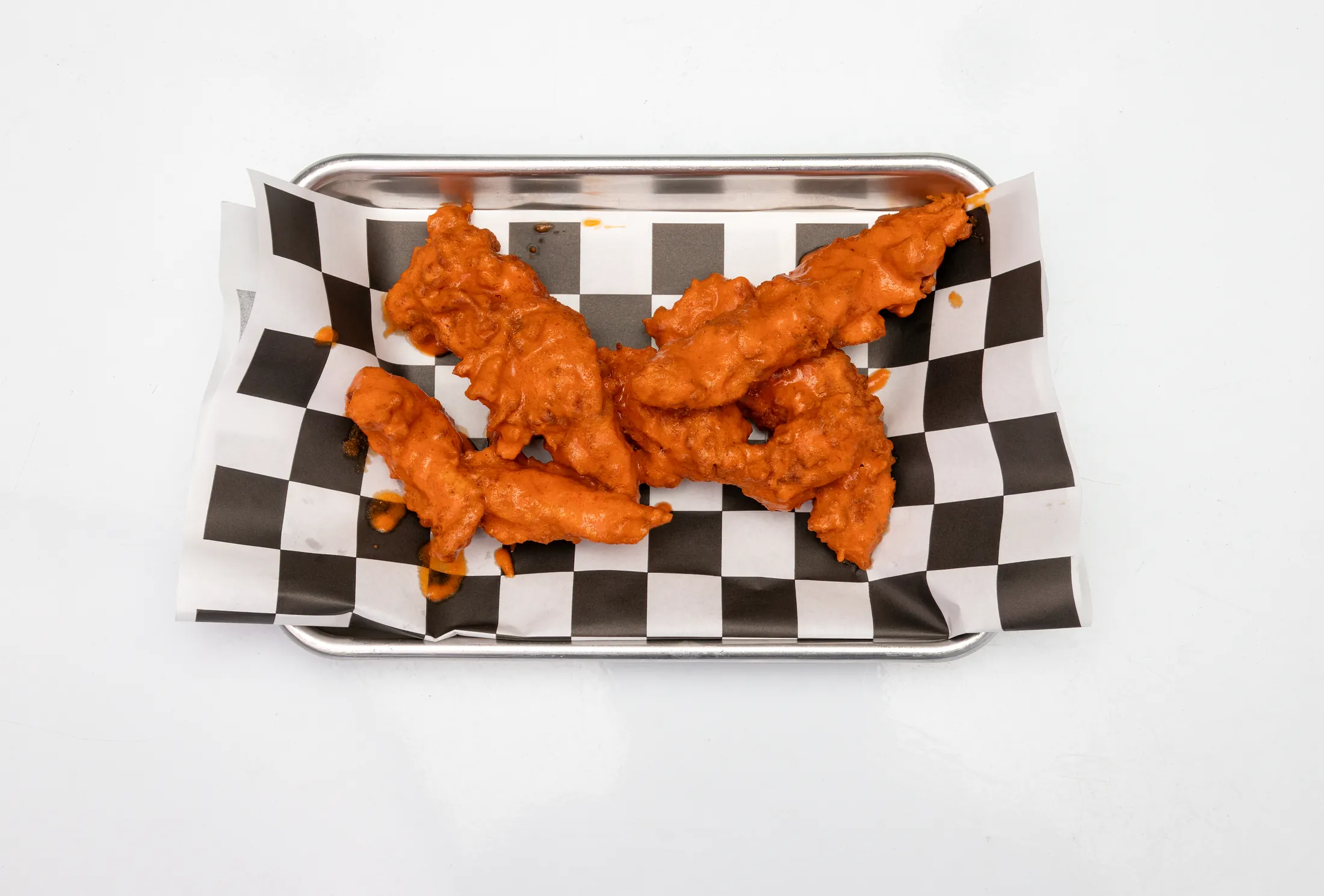 Buffalo tenders hand-breaded and tossed in buffalo sauce at The Rusty Roost