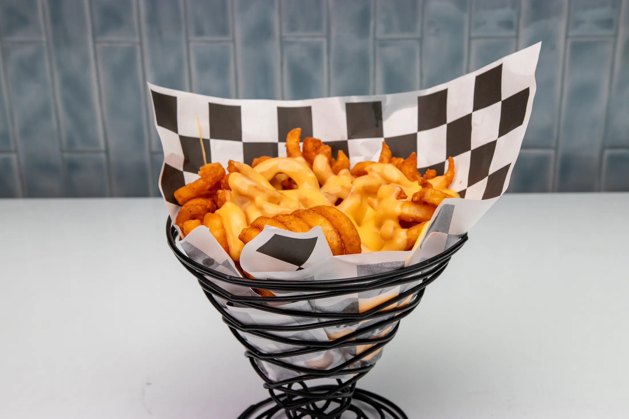Cheesy curly fries with melted cheddar and chives at The Rusty Roost