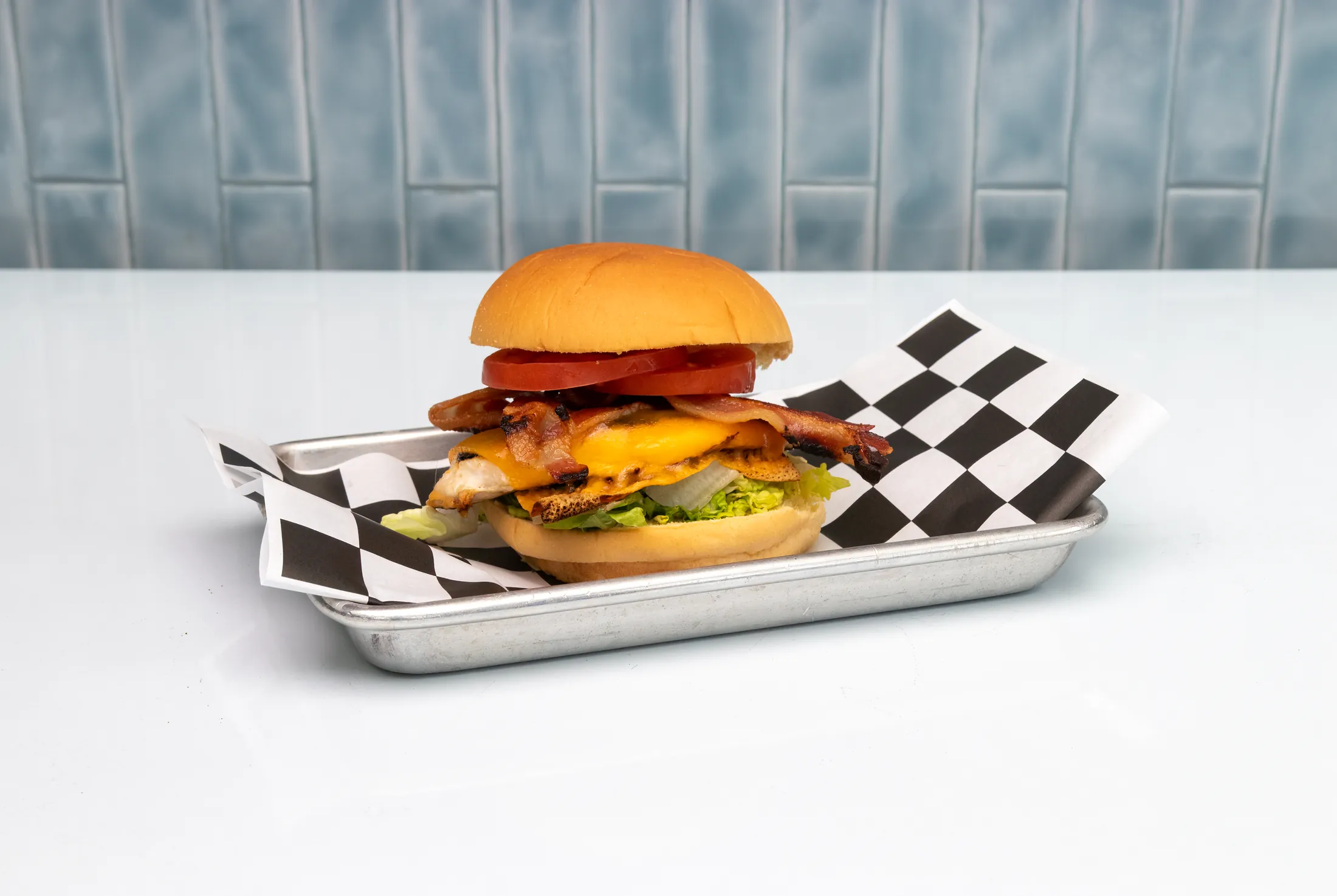 Grilled Rusty sandwich with lettuce, tomato, and herb mayo at The Rusty Roost